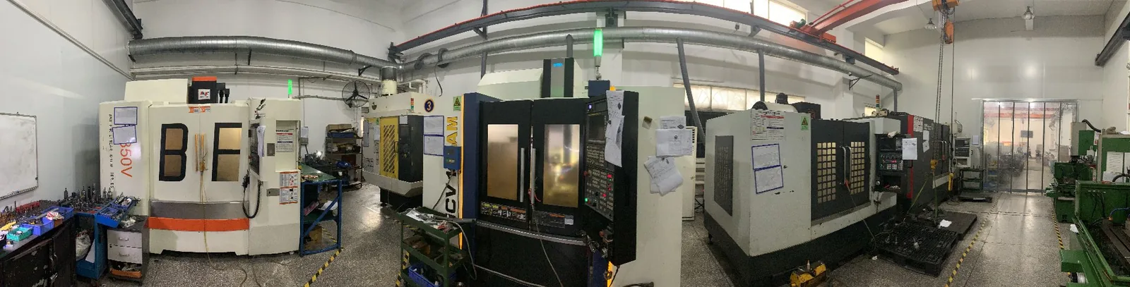Row of CNC machining centers in the H&Q toolroom